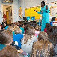Constance Okollet visits elementary school children as part of Inside the Greenhouse’s Climate Wise Women event.