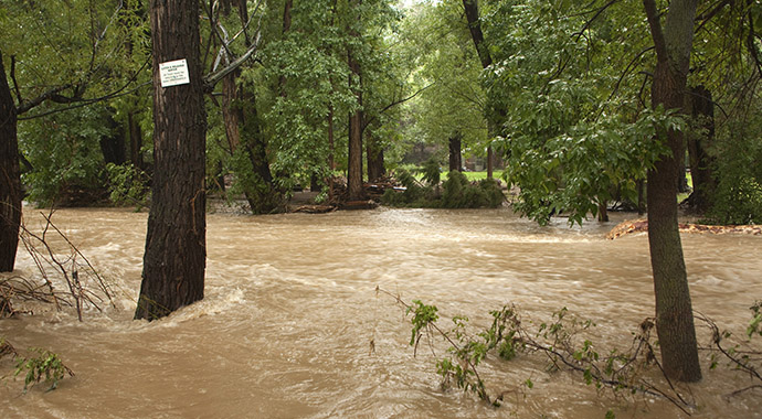 Muddy flood waters of Boulder Creek in Boulder, Colorado, during the rain and flooding event of September 2013.