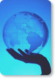 Photo of a hand holding a globe