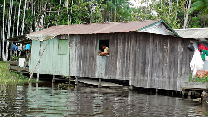 Rising waters. In the rural Amazon, life is adapted to the vagaries of the river. Floating houses like this are an example of the adaptations intrinsic to the area (credit: Sam Schramski).