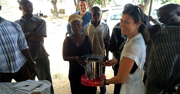 As part of her study, Katie Dickinson presents an improved wood stove to an auction winner that was held in Katiu, Northern Ghana. Photo credit: Katie Dickinson.