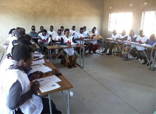 Red Cross volunteers meet for an orientation in Zambia. CU grad student Kanmani Venkateswaran is working in Lusaka, Zambia, with the Zambian Red Cross to develop a community early-warning system for floods.