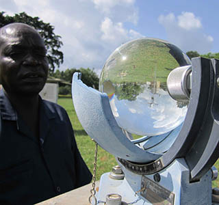 Eddy Francis, meteorologist at the Lira station shows his forecasting equipment